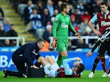 Kevin Long of Burnley receives treatment during the Barclays Premier League match between Newcastle United and Burnley at St James' Park on January 1, 2015