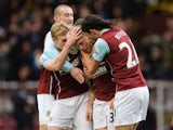 Scott Arfield of Burnley celebrates scoring the opening goal with team mates during the Barclays Premier League match between Burnley and Queens Park Rangers at Turf Moor on January 10, 2015