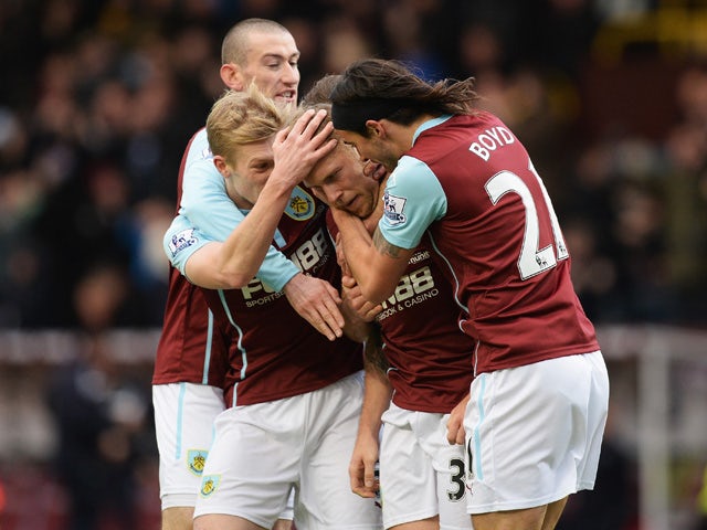 Scott Arfield of Burnley celebrates scoring the opening goal with team mates during the Barclays Premier League match between Burnley and Queens Park Rangers at Turf Moor on January 10, 2015