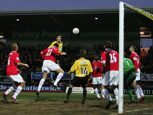Phil Bardsley of Man Utd clears a header from Jon Shaw of Burton off the line during the FA Cup Third Round match between Burton Albion and Manchester United on January 8, 2006 