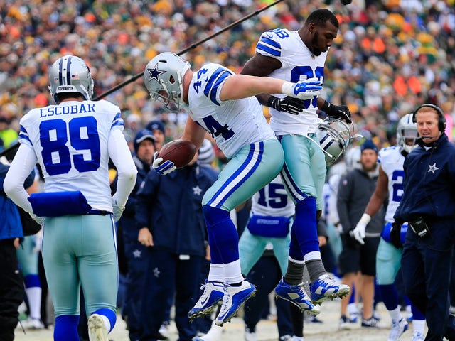 Tyler Clutts #44 of the Dallas Cowboys celebrates after scoring a touchdown against the Green Bay Packers in the first quarter during the 2015 NFC Divisional Playoff game at Lambeau Field on January 11, 2015