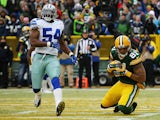 Andrew Quarless #81 of the Green Bay Packers scores a touchdown in the first quarter next to Bruce Carter #54 of the Dallas Cowboys during the 2015 NFC Divisional Playoff game at Lambeau Field on January 11, 2015