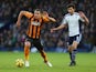 Jake Livermore of Hull City evades Claudio Yacob of West Bromwich Albion during the Barclays Premier League match between West Bromwich Albion and Hull City at The Hawthorns on January 10, 2015