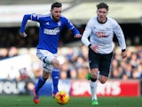 Paul Anderson of Ipswich Town is chased by Jeff Hendrick of Derby County during the Sky Bet Championship match between Ipswich Town and Derby County at Portman Road on January 10, 2015