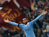 Lazio's midfielder from Brazil Felipe Anderson celebrates after scoring during the Italian Serie A football match AS Roma vs Lazio at the Olympic stadium on January 11, 2015