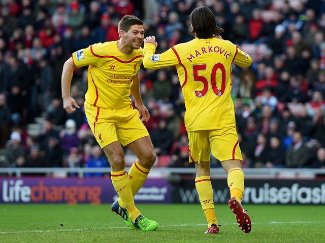Lazar Markovic of Liverpool celebrates scoring the opening goal with Steven Gerrard during the Barclays Premier League match between Sunderland and Liverpool at Stadium of Light on January 10, 2015