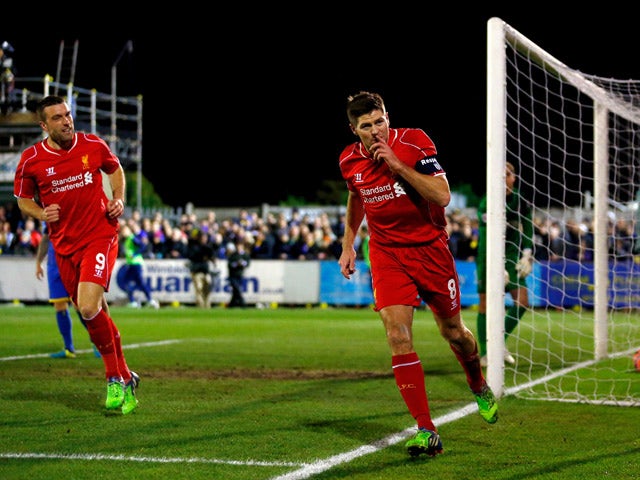 Steven Gerrard of Liverpool celebrates after scoring the opening goal with a header during the FA Cup Third Round match between AFC Wimbledon and Liverpool at The Cherry Red Records Stadium on January 5, 2015