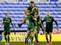 London Irish players celebrate with Shane Geraghty after he kicks the winning points with a drop goal during the Aviva Premiership match between London Irish and Exeter Chiefs at Madejski Stadium on January 11, 2015
