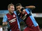 Lyle Taylor (R) of Scunthorpe celebrates with teammate Callum Howe (L) after scoring his team's second goal during the FA Cup Third Round match against Chesterfield on January 6, 2015