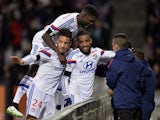 Lyon's French forward Alexandre Lacazette is congratulated by teammates after scoring a goal during the French L1 football match Lyon (OL) vs Toulouse (TFC) on January 11, 2015