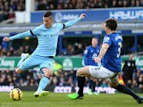 Stevan Jovetic of Manchester City takes a shot on goal as Leighton Baines of Everton atempts to block during the Barclays Premier League match between Everton and Manchester City at Goodison Park on January 10, 2015
