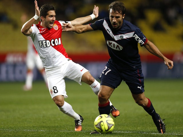 Bordeaux's French defender Marc Planus vies for the ball with Monaco's Portuguese midfielder Joao Moutinho during the French L1 football between match Monaco (ASM) and Bordeaux (GDB) on January 11, 2015