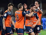 Montpellier's players celebrate after scoring a goal during the French L1 football match between Montpellier and Marseille at the La Mosson Stadium in Montpellier, southern France, on January 9, 2015