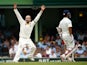 Nathan Lyon of Australia celebrates after taking the wicket of Wriddhiman Saha of India during day five of the Fourth Test match between Australia and India at Sydney Cricket Ground on January 10, 2015