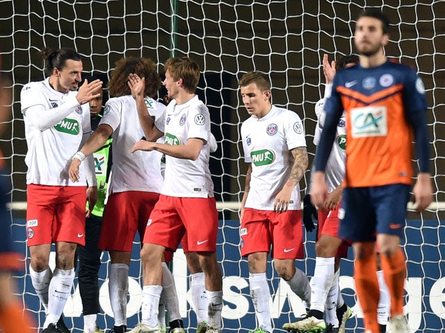 Paris Saint-Germain's players celebrate after scoring a goal during the French Cup football match Montpellier vs PSG, on January 5, 2015
