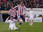 Real Madrid's defender Sergio Ramos vies with Atletico Madrid's forward Fernando Torres during the Spanish Copa del Rey round of 16 first leg football match Club Atletico de Madrid vs Real Madrid CF at the Vicente Calderon stadium in Madrid on January 7, 