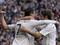 Real Madrid's Colombian midfielder James Rodriguez celebrates with Real Madrid's Portuguese forward Cristiano Ronaldo and Real Madrid's Portuguese defender Fabio Coentrao after scoring during the Spanish league football match Real Madrid CF vs RCD Espanyo