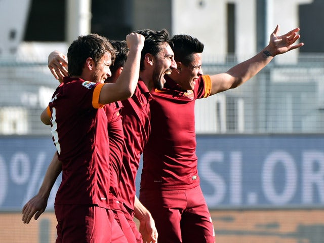 Roma's defender Davide Astori celebrates after scoring during the Serie A football match Udinese vs AS Roma at 'Stadio Friuli' in Udine on January 6, 2015