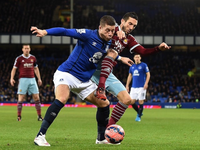 Everton's English midfielder Ross Barkley (L) competes with West Ham United's French midfielder Morgan Amalfitano during the English FA Cup Third Round football match on January 6, 2015