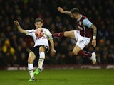Ben Davies of Tottenham Hotspur is challenged by Danny Ings of Burnley during the FA Cup Third Round match between Burnley and Tottenham Hotspur at Turf Moor on January 5, 2015