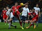 Paul Downing of Walsall clears the ball under pressure from Paul Huntington of Preston North End during the Johnstone's Paint Northern Area Final, First Leg match between Preston North End and Walsall at Deepdale on January 7, 2015