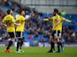 Andre Gray of Brentford celebrates with team mates after scoring the first goal of the game during the Sky Bet Championship match between Brighton & Hove Albion and Brentford at The Amex Stadium on January 17, 2015
