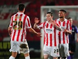 Jack Dunn of Cheltenham Town (C) celebrates scoring his side's first goal during the Sky Bet League Two match between Cheltenham Town and Morecambe at Whaddon Road on January 16, 2015