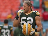 Outside linebacker Clay Matthews #52 of the Green Bay Packers puts in his mouthpiece during warmups before his team played the Miami Dolphins on October 12, 2014