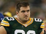 Corey Linsley #63 of the Green Bay Packers looks on from the sidelines during the preseason game against the Kansas City Chiefs on August 28, 2014