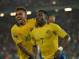 Gabon's Malick Evouna celebrates with teammate Fredeic Wagha after scoring a goal during the 2015 African Cup of Nations group A football match between Burkina Faso and Gabon at Bata Stadium in Bata on January 17, 2015