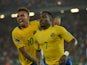 Gabon's Malick Evouna celebrates with teammate Fredeic Wagha after scoring a goal during the 2015 African Cup of Nations group A football match between Burkina Faso and Gabon at Bata Stadium in Bata on January 17, 2015