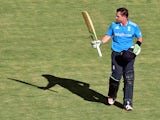 England's Ian Bell salutes the crowd after scoring 187 runs during a cricket tour match between England and the Prime Ministers XI Invitational team at Manuka Oval in Canberra on January 14, 2015