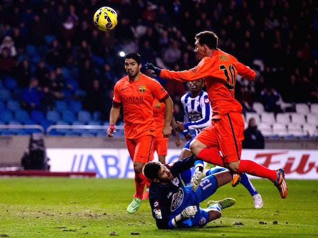 Lionel Messi scores Barcelona's second against Deportivo La Coruna on January 18, 2015