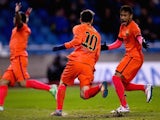 Lionel Messi is congratulated by Neymar after scoring Barcelona's opener against Deportivo La Coruna on January 18, 2015