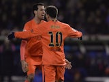 Lionel Messi celebrates his hat-trick for Barcelona with Sergio Busquets on January 18, 2015