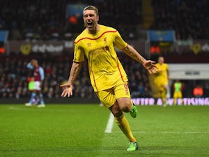 Lambert hails improving Liverpool