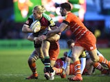Matt Hopper of Harlequins is tackled by Owen Williams of Leicester Tigers during the Aviva Premiership match between Harlequins and Leicester Tigers at the Twickenham Stoop on January 10, 2015