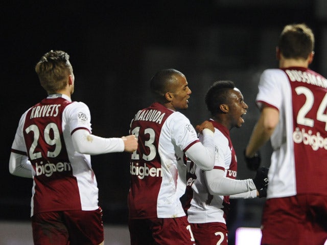 Metz' players celebrate after scoring during the French L1 football match Metz vs Montpellier on January 17, 2015 