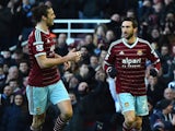West Ham United's Morgan Amalfitano (R) celebrates scoring their second goal with Andy Carroll (L) during the English Premier League match against Hull City on January 18, 2015
