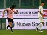 Palermo's forward Paulo Dybala celebrates after scoring during the Italian Serie A football match Palermo vs AS Roma on January 17, 2015