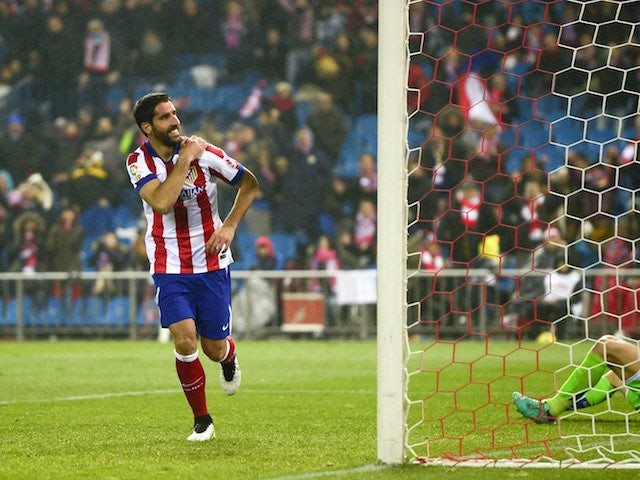 Raul Garcia celebrates scoring Atletico Madrid's second against Granada on January 18, 2015