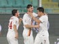 AS Roma's forward Mattia Destro is congratulated by teammates after scoring during the Italian Serie A football match Palermo vs AS Roma on January 17, 2015