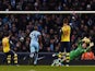 Arsenal's Spanish midfielder Santi Cazorla (L) scores the opening goal from the penalty spot past a diving Manchester City's English goalkeeper Joe Hart (2R) during the English Premier League match on January 18, 2015