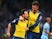 Santi Cazorla of Arsenal (L) celebrates with Olivier Giroud as he scores their first goal from a penalty during the Barclays Premier League match against Man City on January 18, 2015