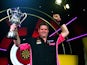 Scott Mitchell of England celebrates with the trophy after winning the mens final against Martin Adams of England during the BDO Lakeside World PDC on January 11, 2015