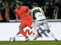 Barcelona's midfielder Sergi Roberto (L) vies with Elche's defender Lomban during the Spanish Copa del Rey (King's Cup) round of 16 second leg football match on January 15, 2015
