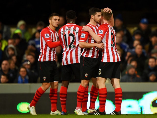 Shane Long of Southampton celebrates with team-mates after scoring the opening goal during the FA Cup third round replay match between Ipswich Town and Southampton at Portman Road on January 14, 2015