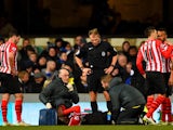 Victor Wanyama of Southampton receives treatment after pulling up with an injury during the FA Cup third round replay match between Ipswich Town and Southampton at Portman Road on January 14, 2015