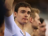 Steven Burke of Great Britain stands on the podium after the Great Britain team won the Team Pursuit final on day one of the UCI Track Cycling World Cup at the Lee Valley Velopark Velodrome on December 5, 2014