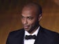 French former star player Thierry Henry hold the name of Real Madrid and Portugal forward Cristiano Ronaldo who won the 2014 FIFA Ballon d'Or award on January 12, 2015